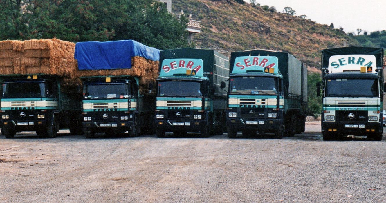 The Serra truck fleet in the late 1970s, some loaded with bales of fodder