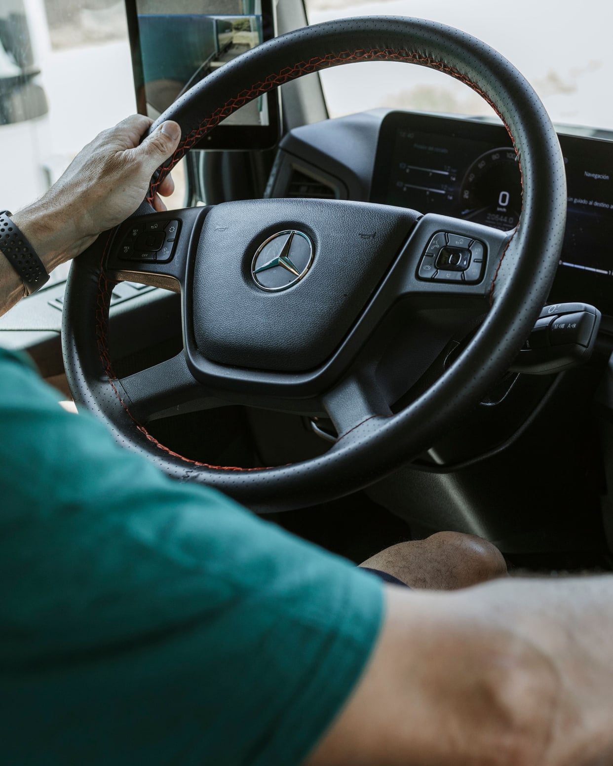 Driver in the cab of a Seber Logístics truck